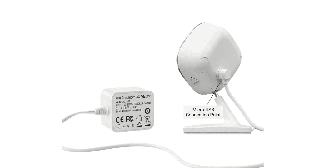 Arlo Q included AC adapter — showing the adapter body with voltage/current specifications label visible (5V, 1.0A), the fixed Micro-USB cable